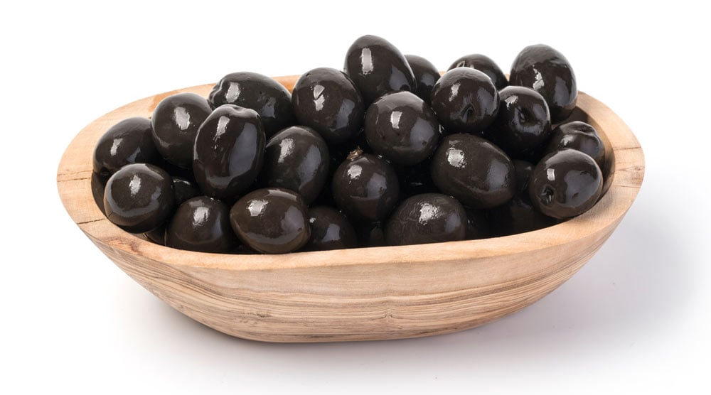 A bowl full with black olives