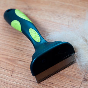 Deshedding tool to reduce shedding